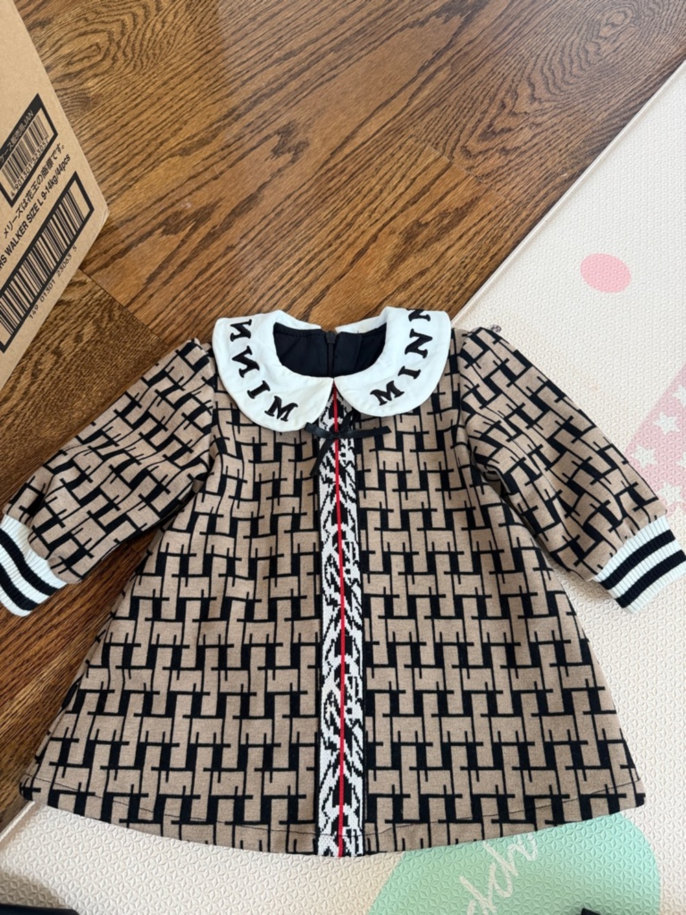 Cherubic Beige & Black Patterned Baby Dress with Statement Collar